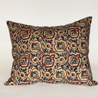 Yellow with blue and red floral pillow
